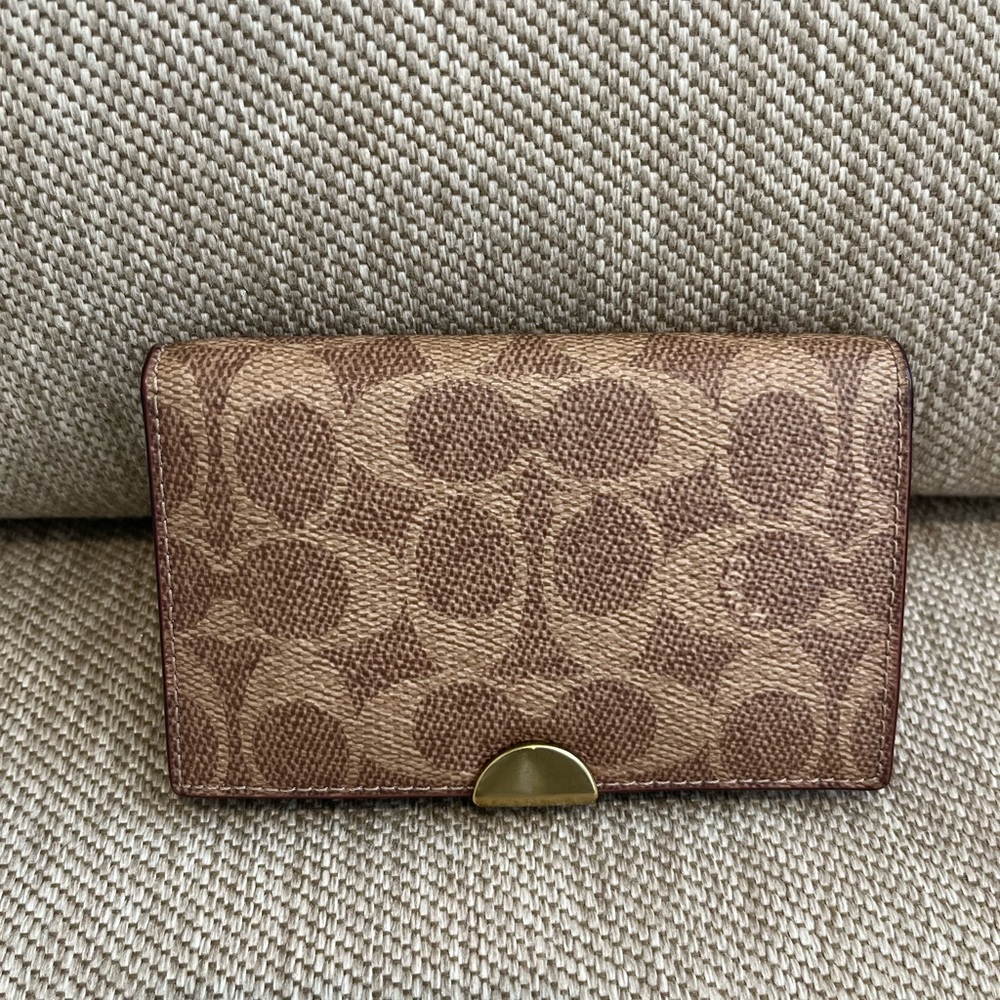 Authentic preowned Coach signature card wallet.